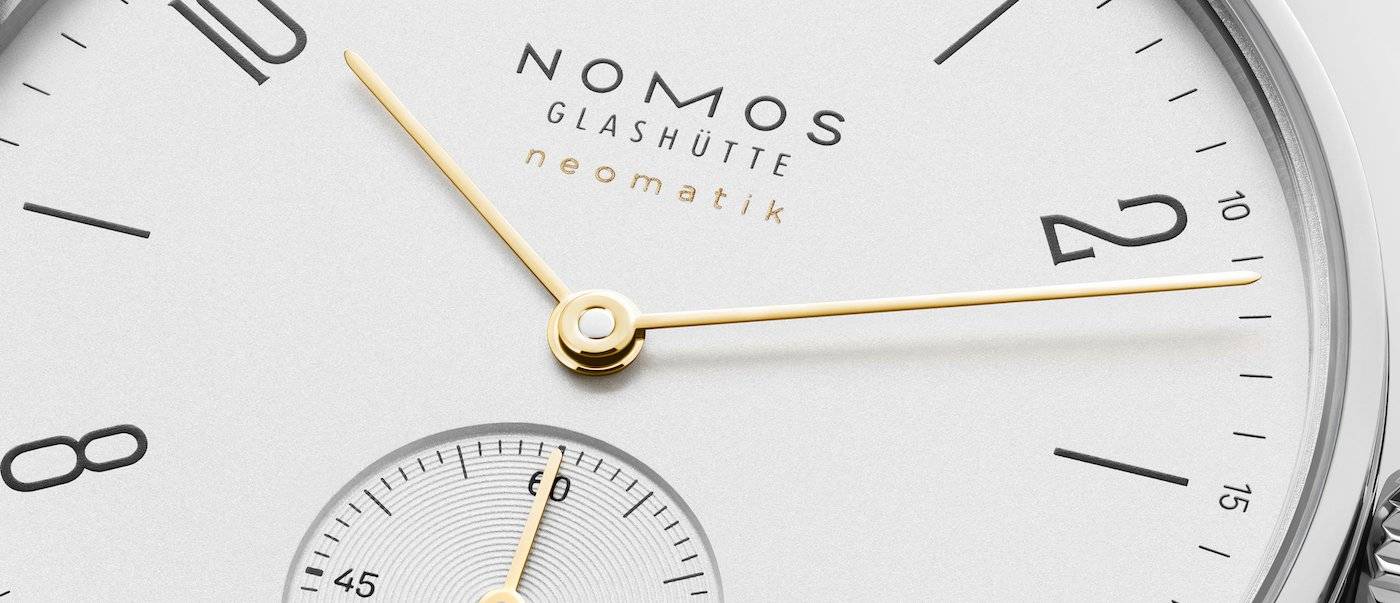 Nomos Orion neomatik doré y Tangente neomatik doré